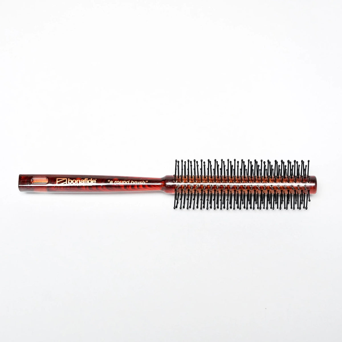 Bonafide round styling brush with tortoiseshell handle and black bristles